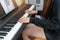 Banner close up picture of hand of young pianist playing piano