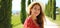 Banner crop portrait of young beautiful woman in Tuscany. Close up of beautiful fashion woman walking in cypresses lane on sunny