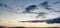 Banner Cumulus clouds of the sunset with the sunset Blue sky blurred background defocusing