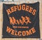 A banner at the Dom in Regensburg for welcoming refugees in english words