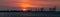 Banner. Dramatic panorama evening sky over beautiful port at sunset