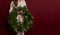 Banner. Faceless young woman in knitted white sweater holds green Christmas wreath in hands