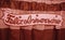 Banner Feliz Aniversario on a red curtain