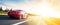 Banner of a generic and unbranded red sport car running in sunset, ai generative illustration