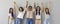 Banner with group portrait of happy diverse women standing together and holding hands