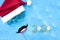 Banner. Hat of Santa Claus with goggles for swimming and the moustache and the smile. Christmas vacation, sandals and