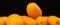 Banner kumquat, fresh citrus fruits on a black backgroud. Cumquat, healthy food, raw diet concept. Copy space photo