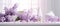 Banner with lilac branches on a glossy white table