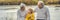 BANNER, LONG FORMAT Senior couple with baby grandson in the autumn park. Great-grandmother, great-grandfather and great