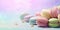 Banner macarons cookies, different colors, blurred background, colourful macaroons bisquits close-up.