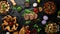 Banner. Meat and vegetable dishes and snacks on black background. Top view.