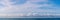 BANNER PANORAMA real photo natural cloudscape wallpaper. Beautiful white fluffy cumulus clouds summer blue sky calm
