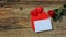 Banner. Red roses flowers with red hearts on old wooden background. Romantic Valentines holidays concept. Copy space. Top view