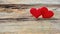 Banner. Red roses flowers with red hearts on old wooden background. Romantic Valentines holidays concept. Copy space. Top view