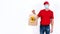 Banner. Safe contactless remote delivery of holiday gifts during coronavirus pandemic. A courier in red uniform and