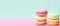 banner, stacks of colorful macaroons on a bright background, space for text