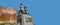 Banner with statue of great scientist Otto Guericke in Magdeburg at blue sky solid background with copy space, Germany, closeup,