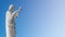 Banner with a statue of Jesus Christ praying at the church of Notre Dame de la Garde in Marseille, France, blue sky, smooth