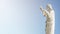 Banner with a statue of Jesus Christ praying at the church of Notre Dame de la Garde in Marseille, France, blue sky, smooth