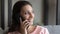 Banner view of smiling ethnic woman talk on cellphone