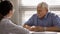 Banner view of smiling senior patient at hospital consultation