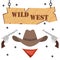 Banner wild west with revolvers and a cowboy hat.