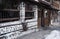 Bansko, Bulgaria ? January 27, 2016 - Snow winter street in the Bansko town with ancient houses. Stone house. Visit of ancient tow