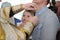 The baptism of a child.Hair cutting for baby baptism.The tonsure