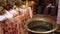 A baptismal font in an Orthodox church with candles