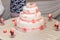 Baptize cake with sugar shoes and burning candles