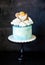 Baptizing blue cream cake with gingerbread cookies