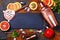 Bar accessories, drink tools and cocktail ingredients on rusty stone table. Flat lay style