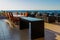 Bar on balcony of the resort overlooking the sea, the setting sun, Greece, Europe