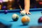 Bar billiard - hand aiming the cue ball