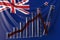 Bar chart with downward trend against flag of New Zealand. Financial crisis or economic meltdown related conceptual 3D