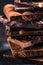 Bar of Chocolate tower pieces. Hazelnut and almond dark chunks of broken chocolate. Sweet food photo concept