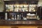Bar counter with alcohol bottles assortment