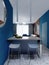 Bar counter with two chairs in the youth interior of a studio apartment in blue