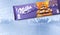 Bar of Milka chocolate isolated on froze background