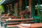 Bar in Oost, Amsterdam, Netherlands. Outside street view of long wooden tables with sign Reserve