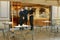 Bar and restaurant waiters attending for customers wearing protective masks selective focus