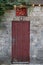 Bar Sign Above Red Door