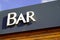 Bar sign text on pub a city street storefront building