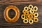 Baranka with poppy, small bread rings on wooden table. Top view