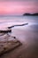 Baratti bay, headland hill, rocks and sea on sunset. Tuscany, It