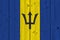 Barbados flag painted on old wood plank