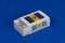 Barbados flag on white box with barcode and the color of nation flag on blue background, paper packaging for put match or products