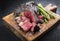 Barbecue dry aged wagyu bistecca alla fiorentina beef steak sliced with large filet piece with green asparagus