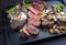 Barbecue dry aged wagyu Brazilian picanha steaks from the sirloin cap of rump beef sliced and served cream sauce and mushroom