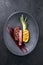 Barbecue dry aged wagyu roast beef with grilled pineapple peace and hot smoked sauce on a modern design plate h cop